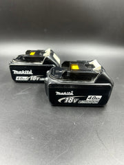 Makita drill driver combo set with x2 4.0ah batteries, charger, grip handle and hard case.