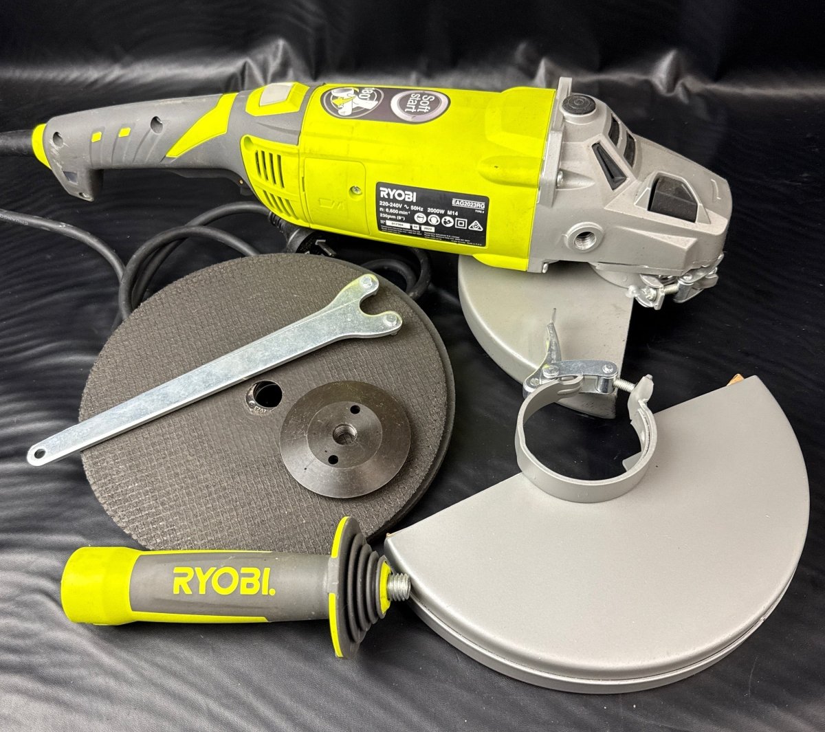 Ryobi 2000W 230mm Corded Angle Grinder EAG2023 in hard case with accessories. - Mega Cash Sydney